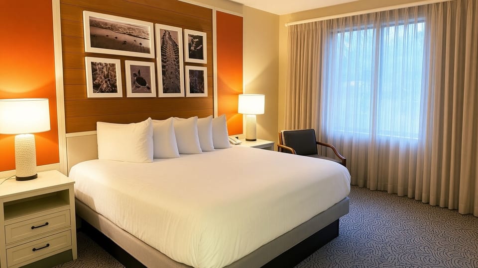 Primary Bedroom • King Bed & Coastal Artwork