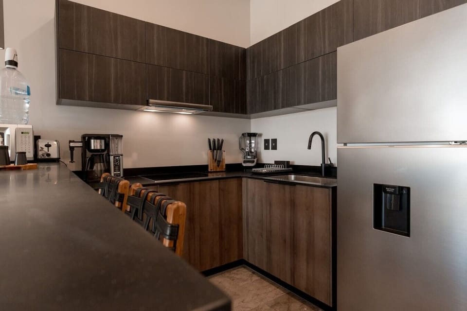 Fully equipped kitchenCook with ease in the modern kitchen featuring premium appliances, spacious counters, and everything you need for your stay.