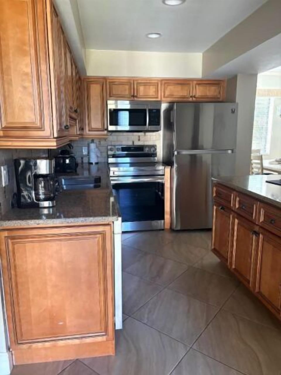 Bright kitchen with stainless appliances and generous counter space