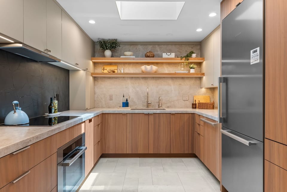 Sleek modern kitchen with warm wood finishes and stylish open shelving