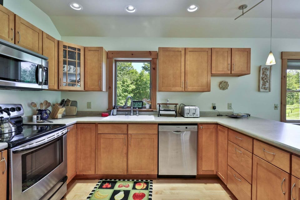 Ample counters around the range and sink make meal preparation easy for the group.