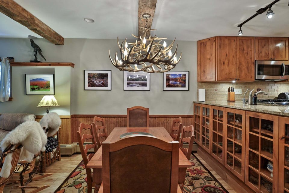 Breakfast reaches the table quickly, while dinner can linger beneath the antler-style light.