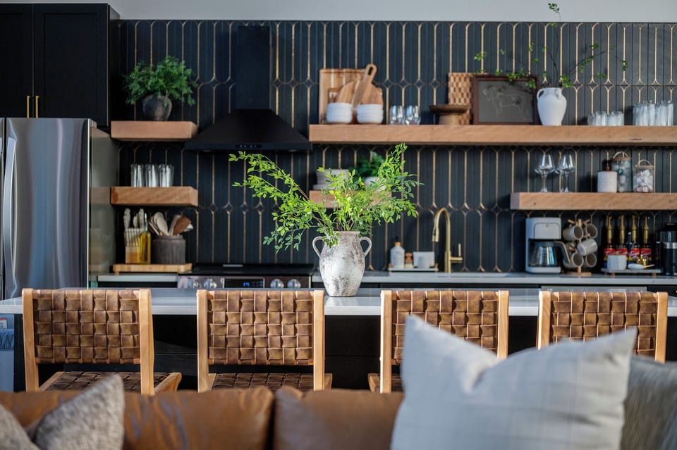 A beautifully designed, fully stocked kitchen made for gathering, with generous counter seating, modern finishes, and everything you need for easy meals, coffee & time together.
