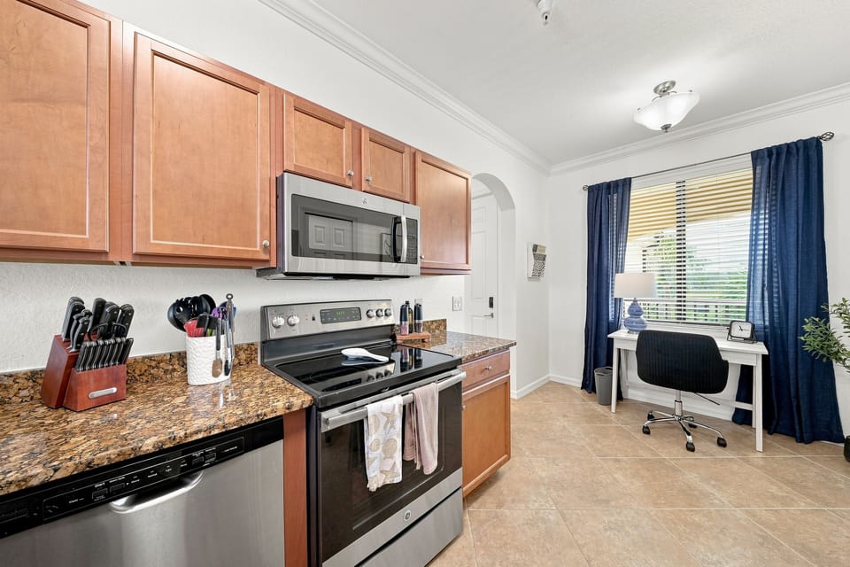 Spacious kitchen includes a desk nook.