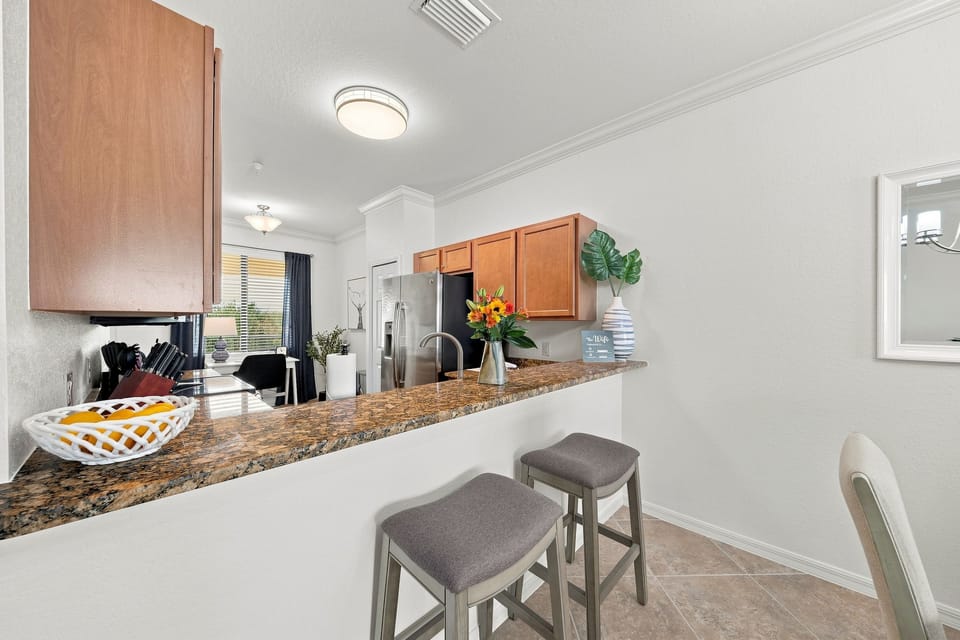 Expansive kitchen bar allows everyone to be part of the fun.