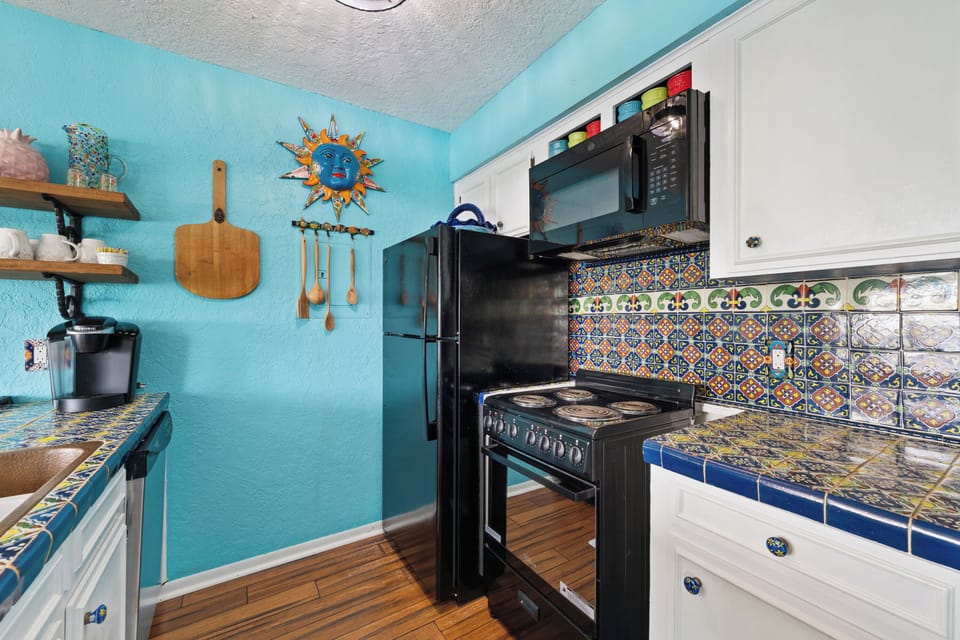 Prepare your favorite meals in this vibrant and well-equipped kitchen.