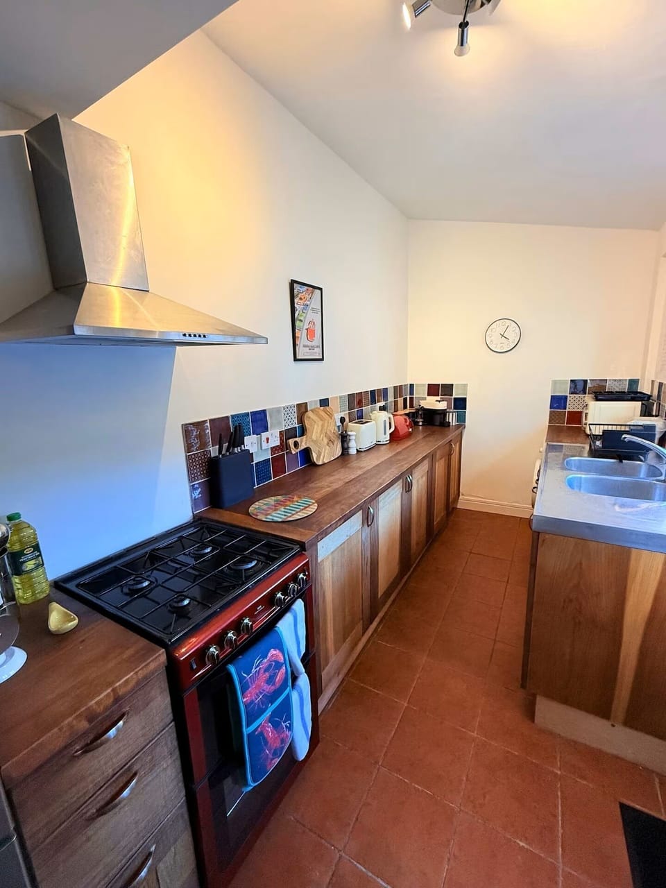 The fully equipped kitchen features a Nespresso machine and a washing machine