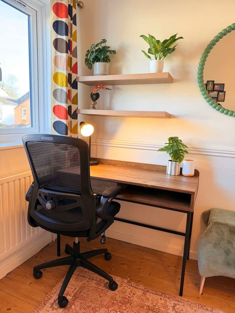 The second bedroom features a comfortable double bed and a dedicated desk, perfect for remote work or studying