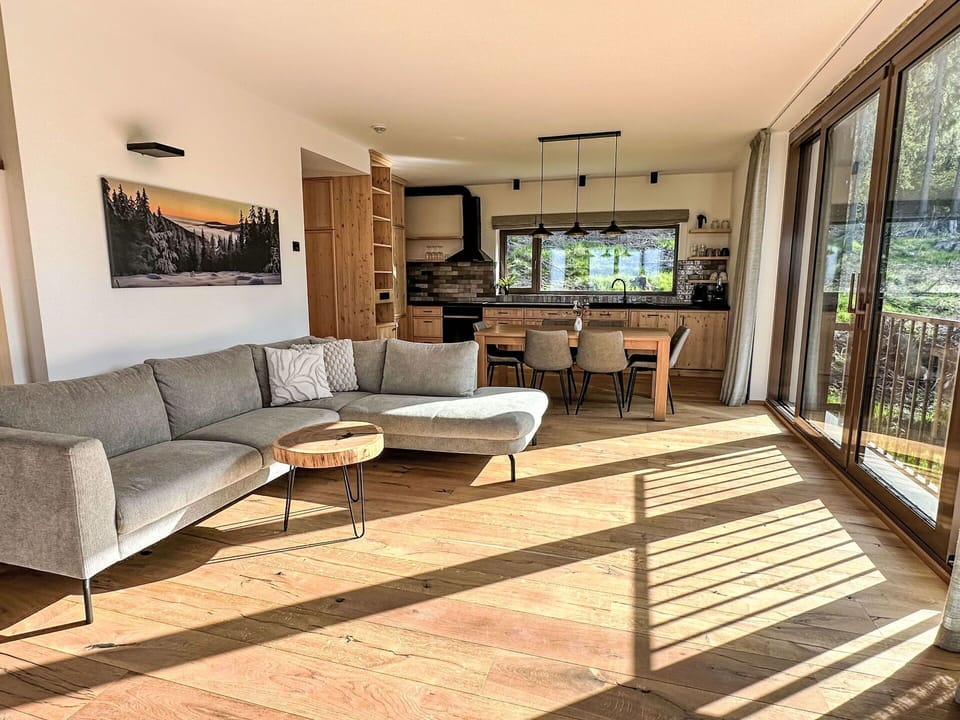 Furniture, Flooring, Interior Design, Floor, Wood, Couch, Wood Flooring, Living Room, Table, Home