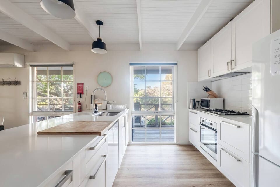 Cook with ease in the full kitchen, equipped with an oven, stove, microwave, dishwasher, refrigerator and all the essentials for effortless group meals.
