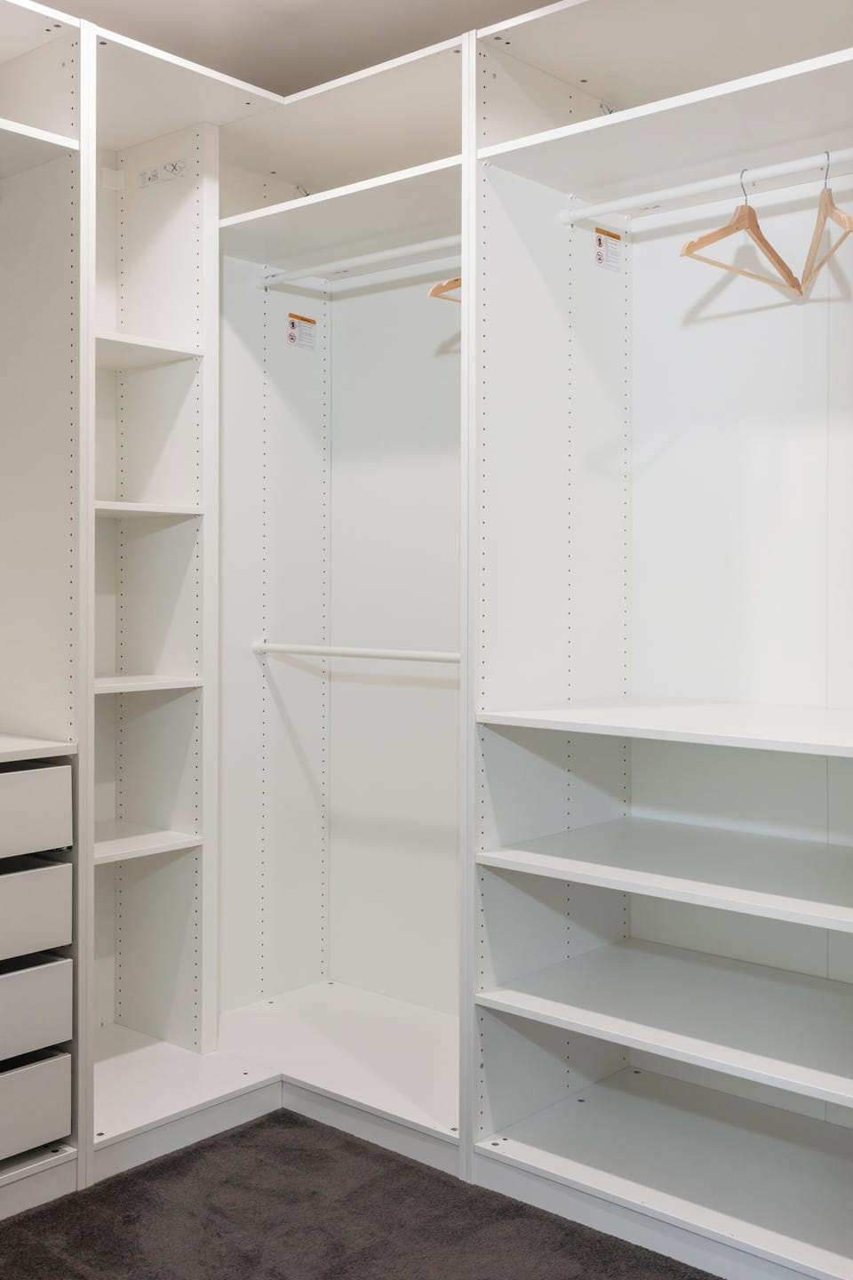 The primary bedroom's walk-in wardrobe provides generous storage to help you settle in comfortably throughout your stay.