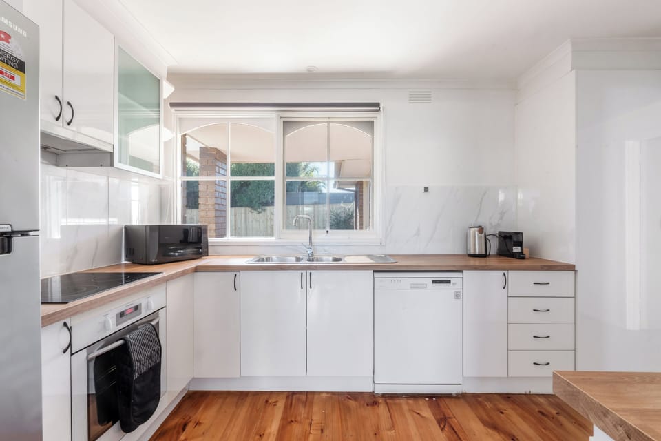 Prepare everything from quick breakfasts to home-cooked dinners in the well-equipped kitchen, where ample storage and modern appliances make cooking easy.