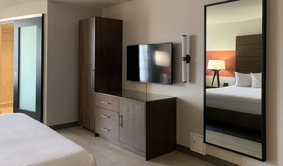 Get ready easily with ample storage and in-room entertainment.