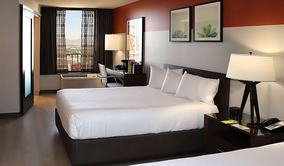 Wake refreshed to soft daylight and a peaceful city backdrop.