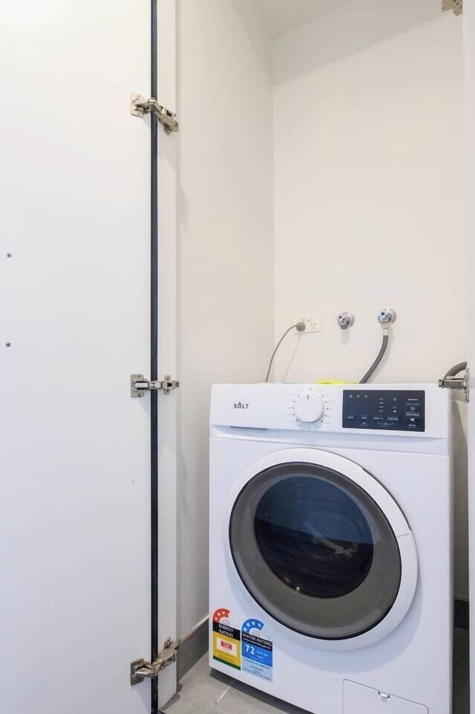 Tucked neatly into a cabinet, the front-load washer makes packing light a breeze.