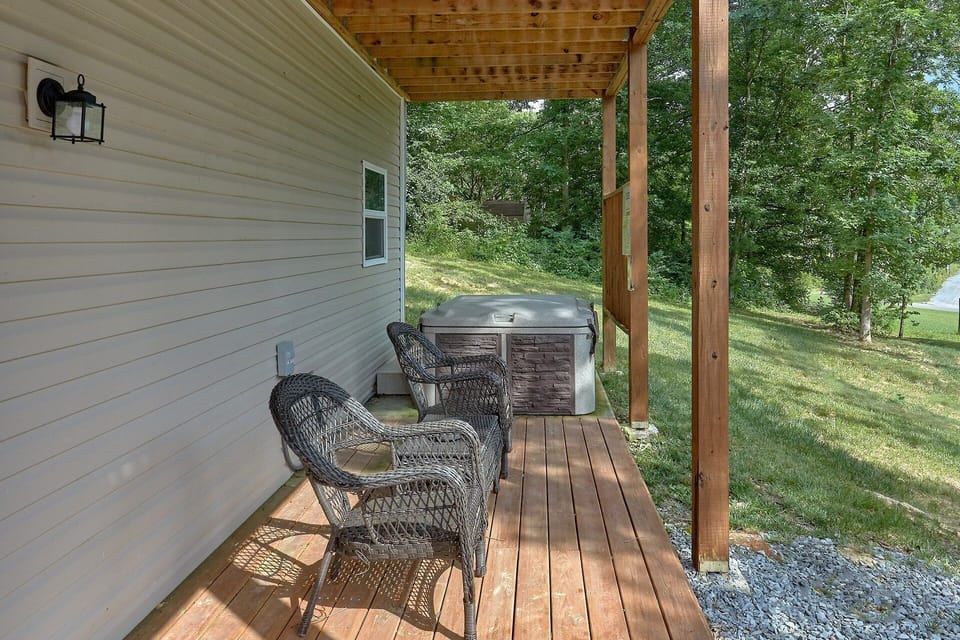 Covered Porch with Hot Tub and Chairs
