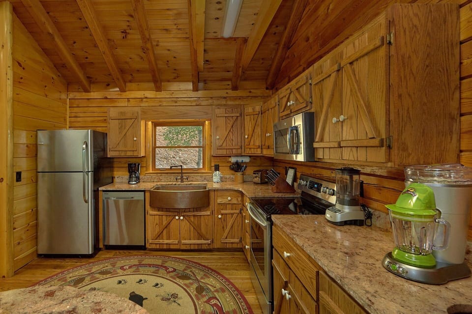 Kitchen with granite counters in 2 bedroom cabin