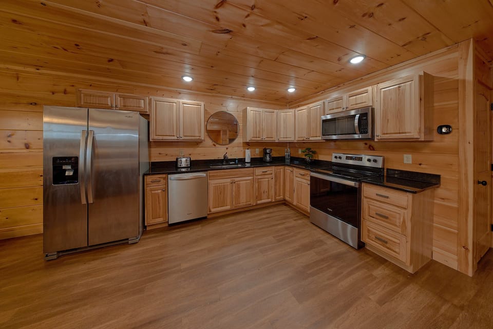 Full kitchen and dining room in 3 bedroom cabin