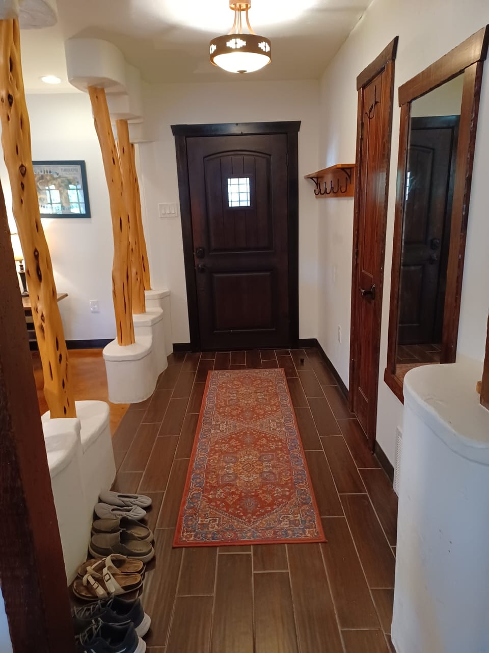 Front door and entry hall with coat closet. 