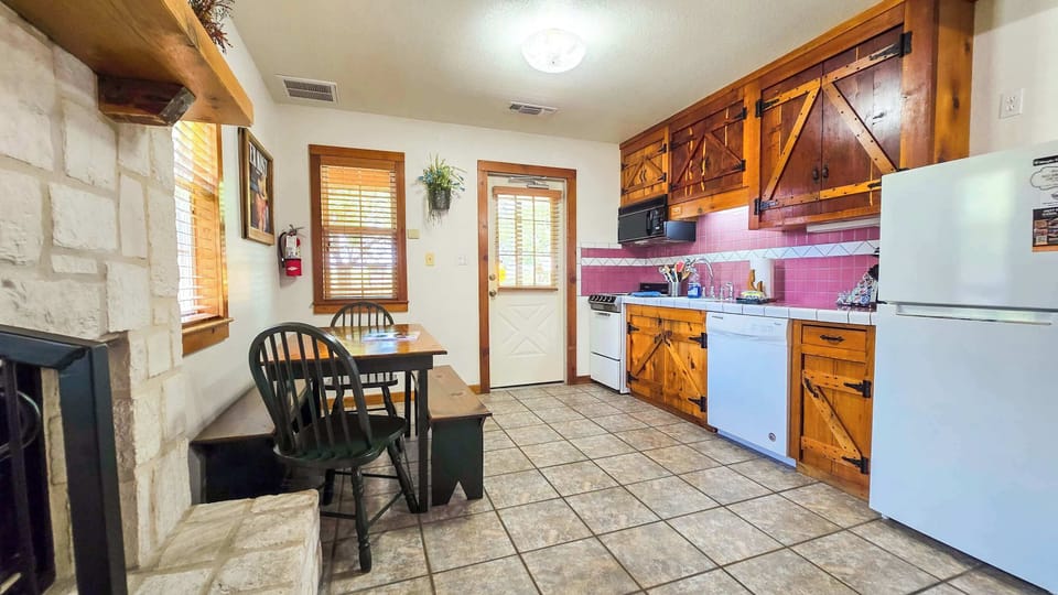 The lower-level studio’s inviting eat-in kitchen is spacious & offers all the comforts of home​