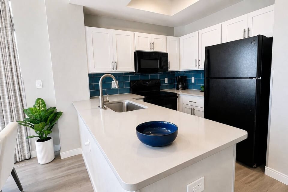 Everything you need for easy vacation meals!  The bright, fully stocked kitchen features full-size appliances, generous counter space, and a coffee maker—perfect for breakfast before the beach or dinner at home.