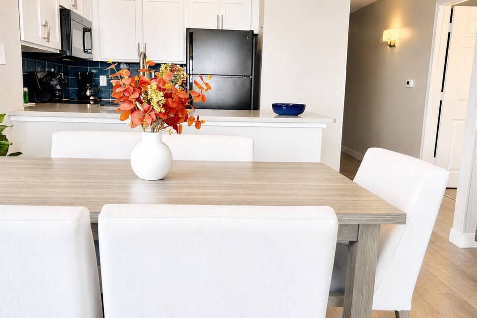 Gather for family meals, morning coffee, or game night, with the fully equipped kitchen just steps away for easy vacation dining.