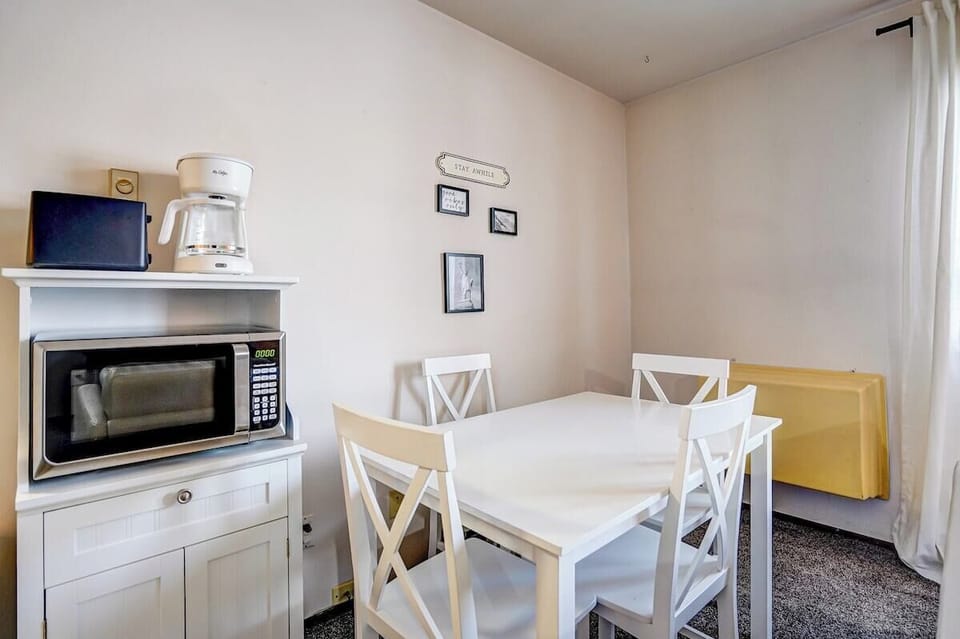 Dining area. Coffee pot and Microwave.