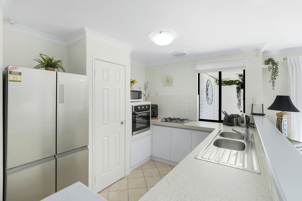 Two door refrigerator to store your food, kitchen is very clean! 
