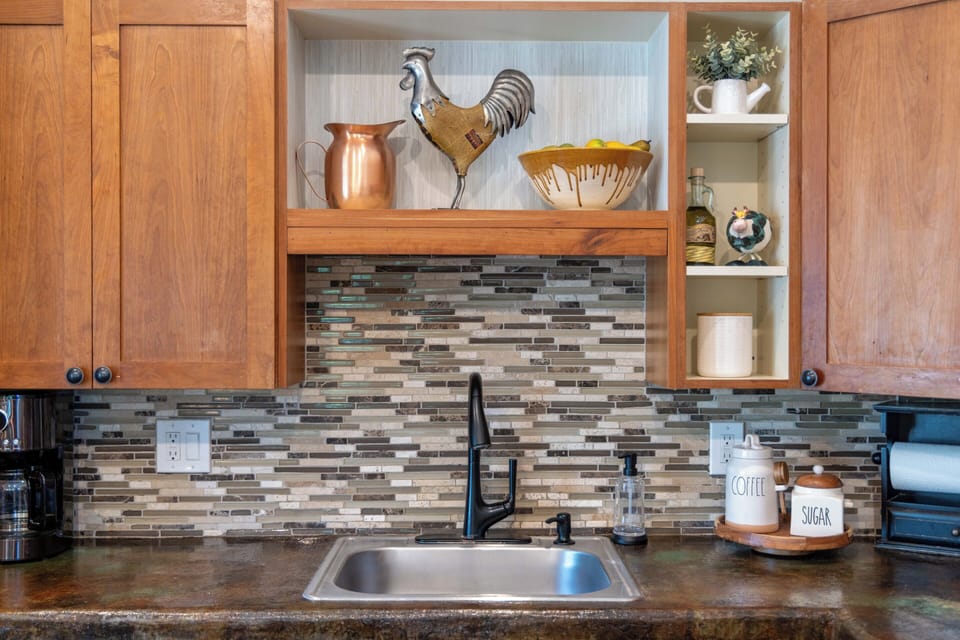 Bright kitchen space with natural light, ample counters, and convenient coffee station.