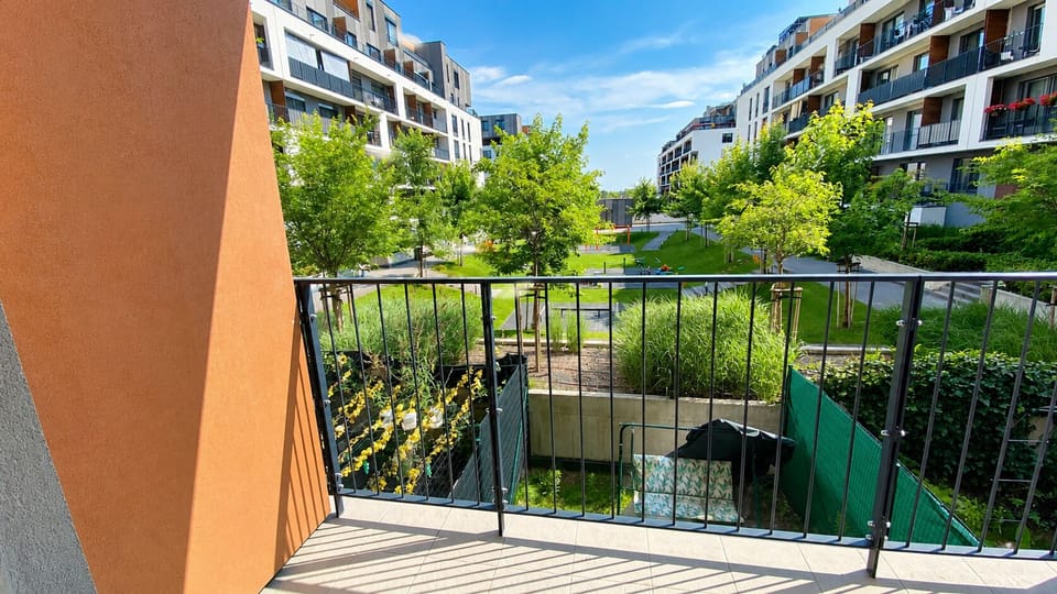 Private balcony with serene courtyard views in a modern complex