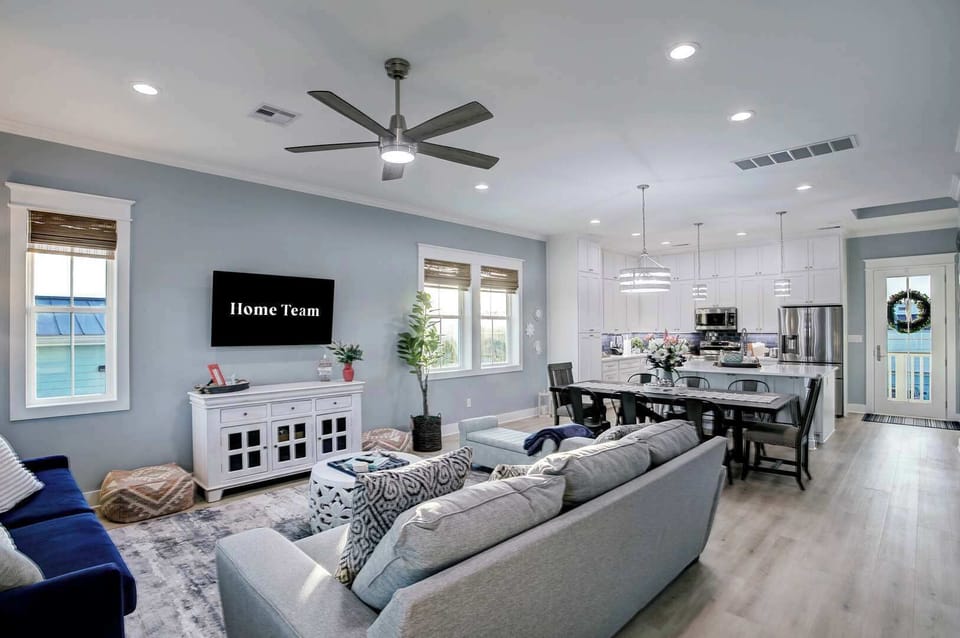 Gather the whole crew for game night — open-concept living, dining, and kitchen make hosting effortless.