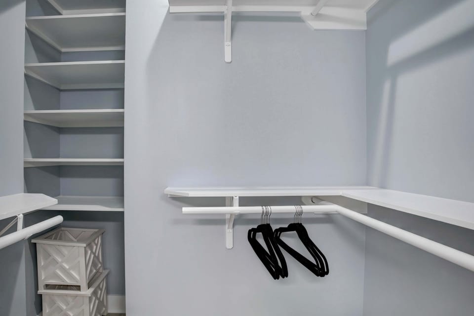 Unpack and settle in — this walk-in closet gives everyone room to spread out their stuff.