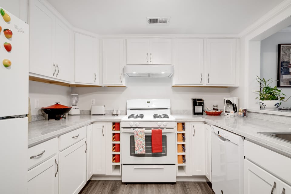 Well-equipped kitchen with gas range, microwave & everyday cooking essentials.