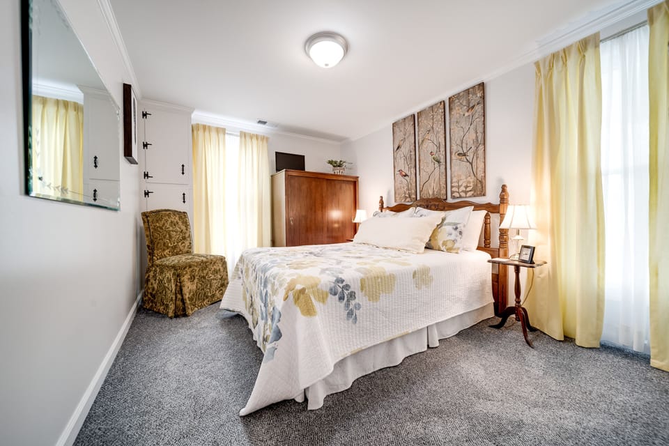 Bedroom 2 offers a comfortable double bed and plenty of natural light