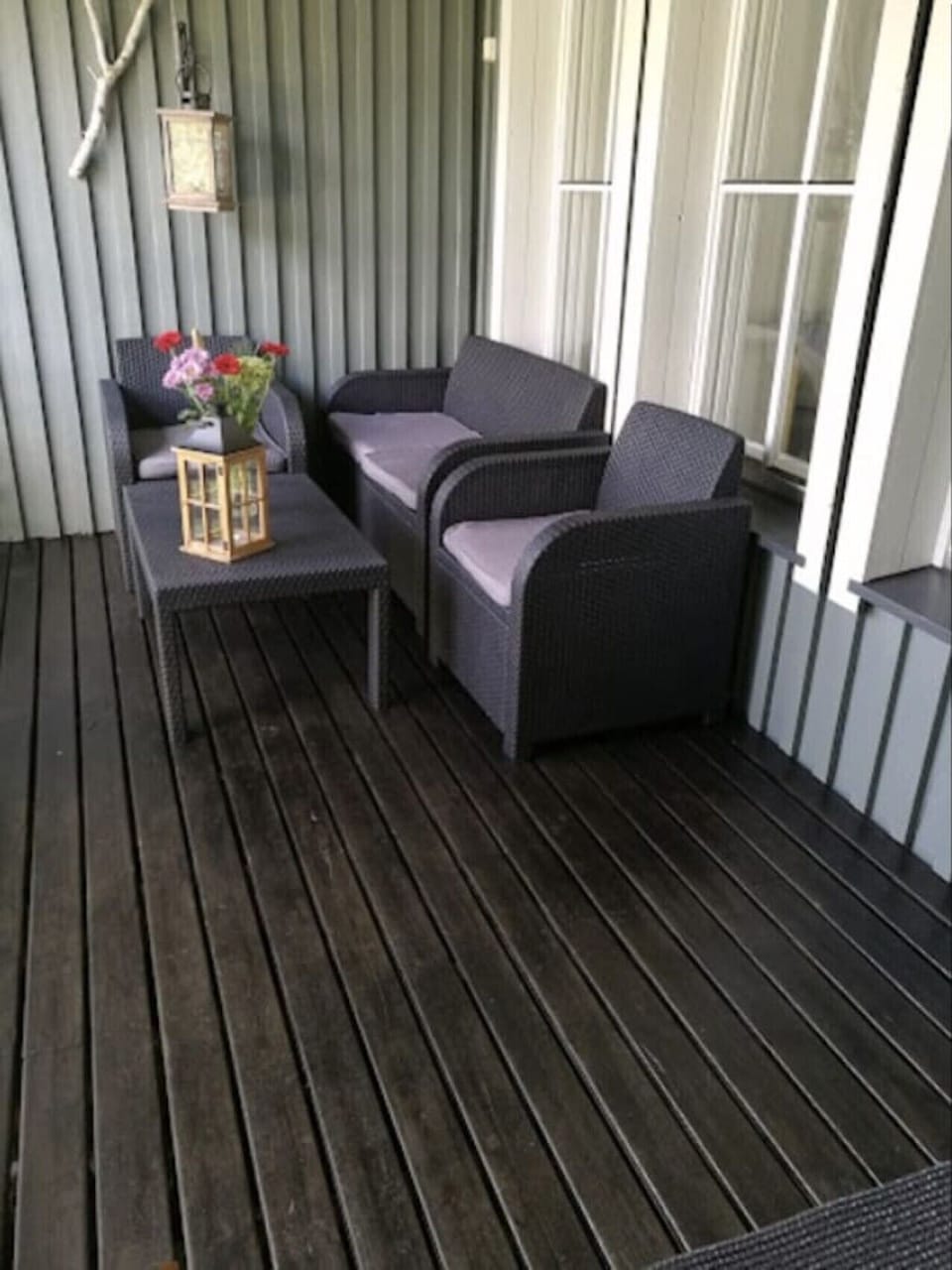 Furnished terrace with comfortable armchairs for relaxing outdoors.