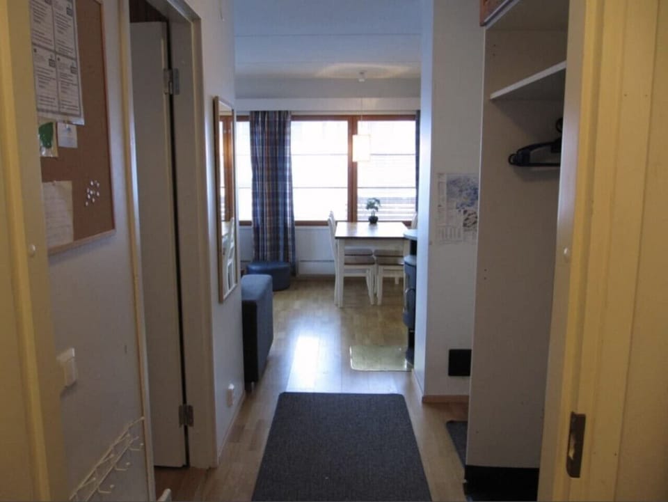 Entrance hallway leading into the open living and dining area.