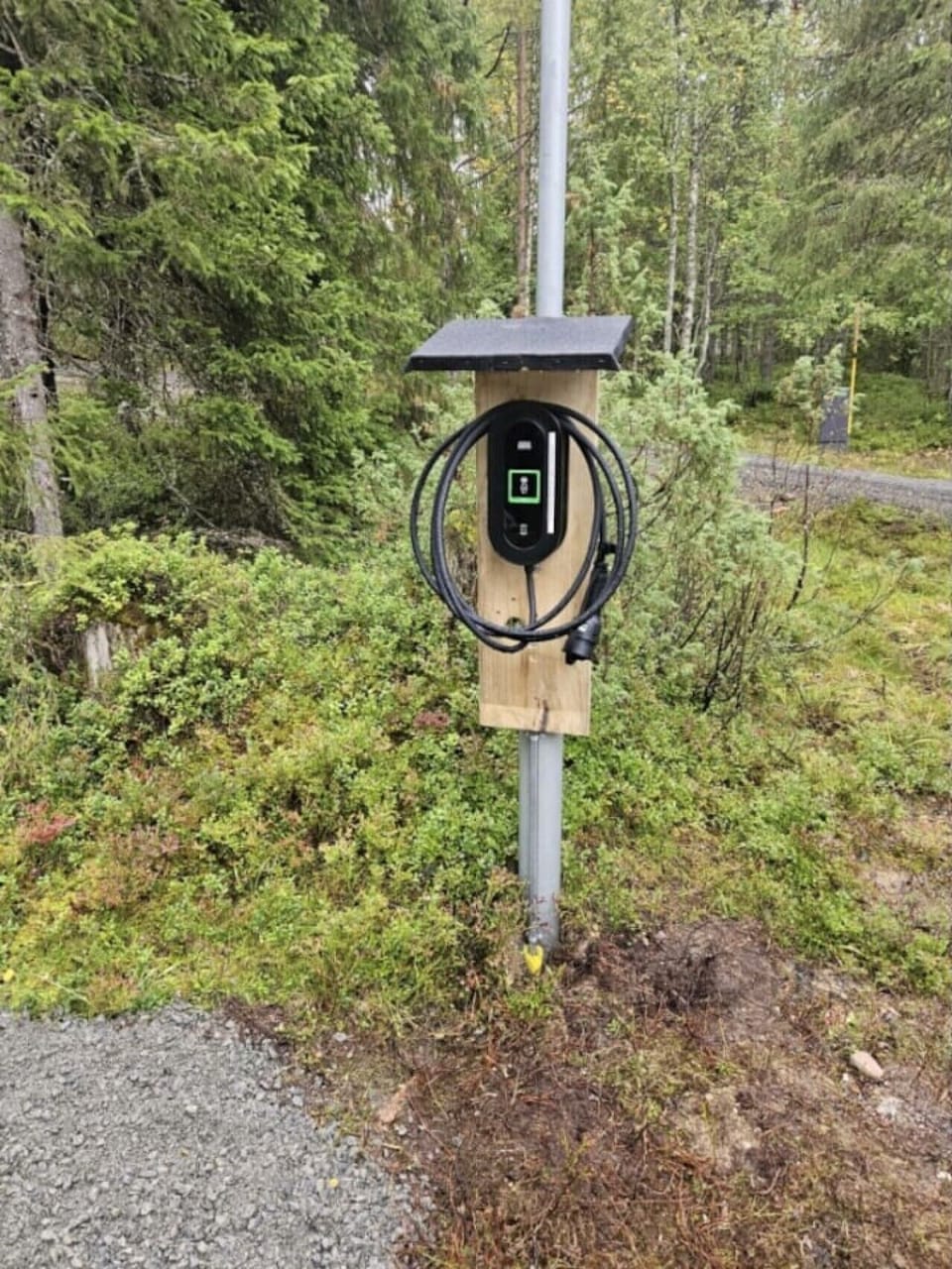 Electric vehicle charging point on the property.