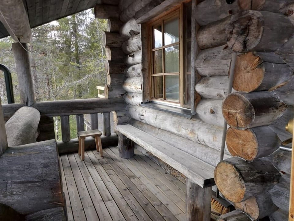 Terrace with bench and firewood storage
