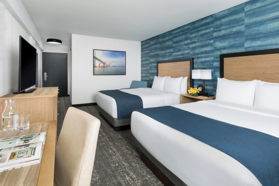 Stretch out in a spacious double-queen room with TV.