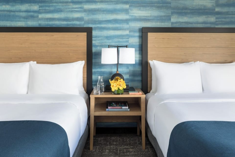 Wake up together in twin beds with cozy, modern styling.