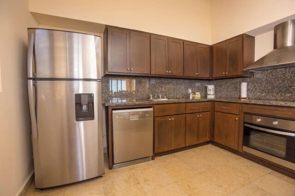 Modern kitchen with granite counters and stainless steel appliances