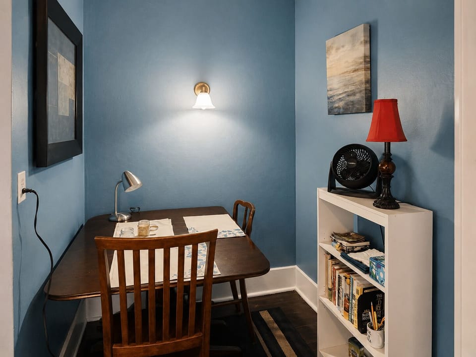 Enjoy a quiet, intimate meal for two at the cozy wooden dining table.