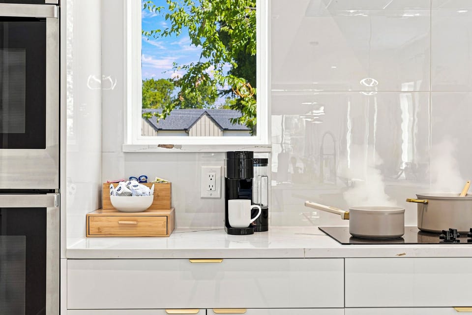 Bright and airy, perfect for culinary creativity with stunning views just outside!