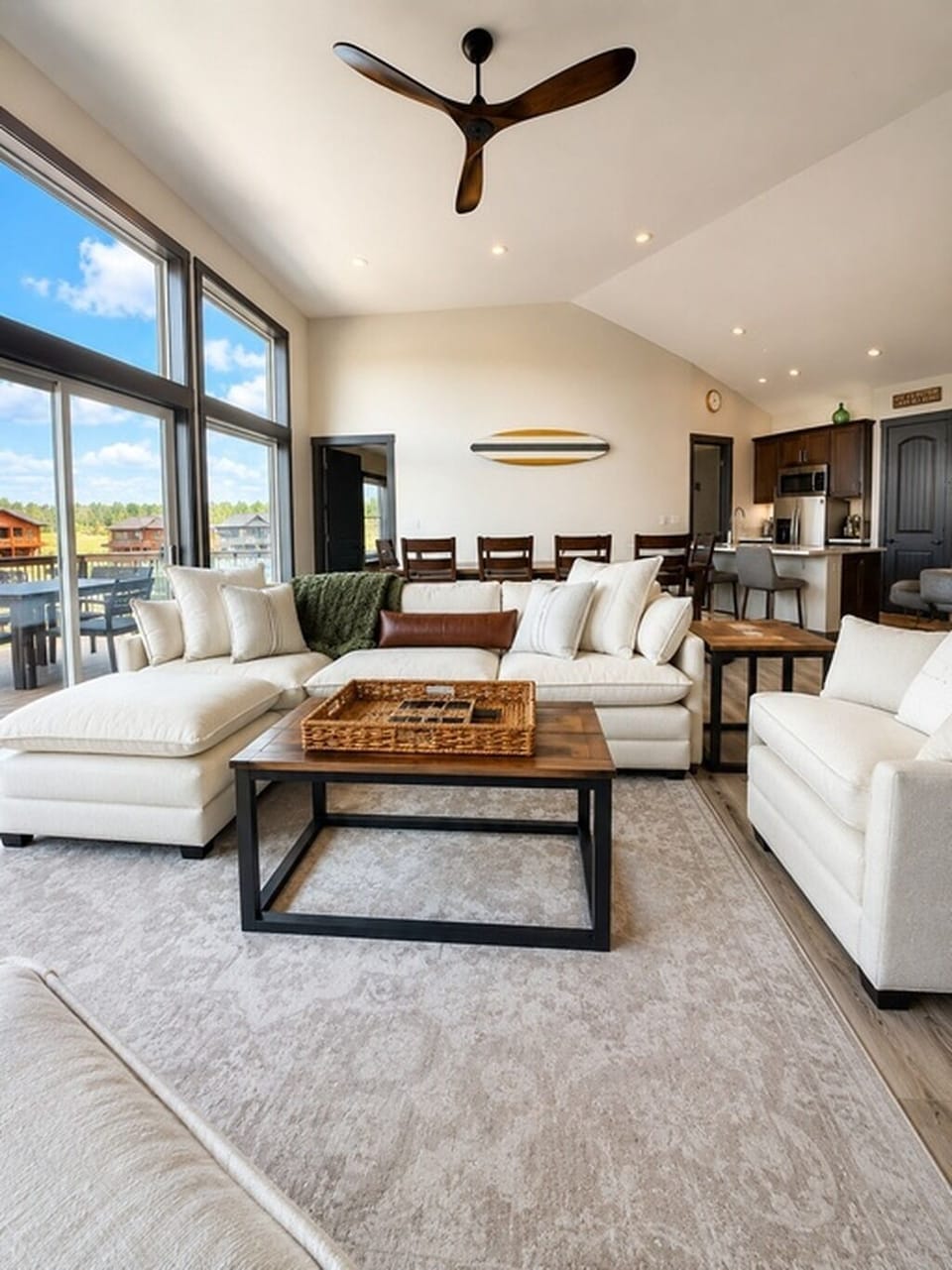 Bright, spacious lakeview living room with plush seating and room to gather.