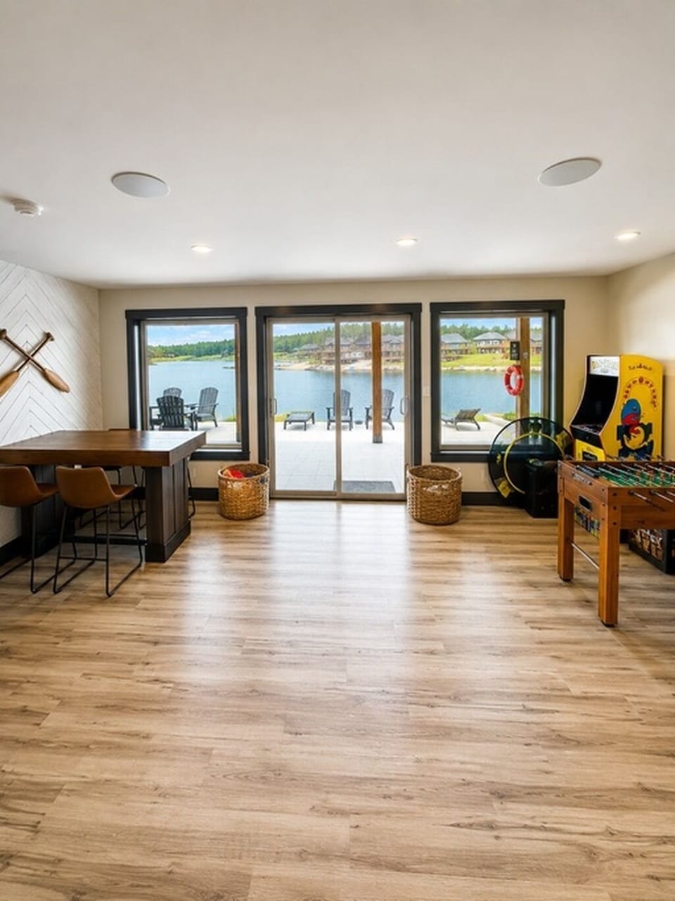 Lakefront game room with Pac-Man, foosball, game table and beach access.