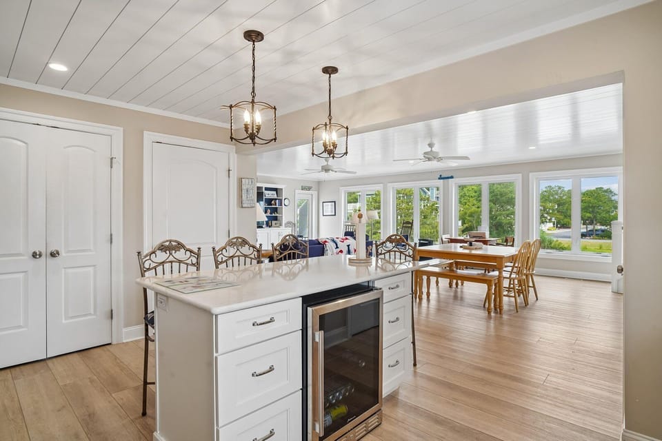 Step into your bright, open-concept space where natural light floods through expansive windows. Your kitchen island invites casual conversation while ceiling fans keep you comfortable on warm afternoons.