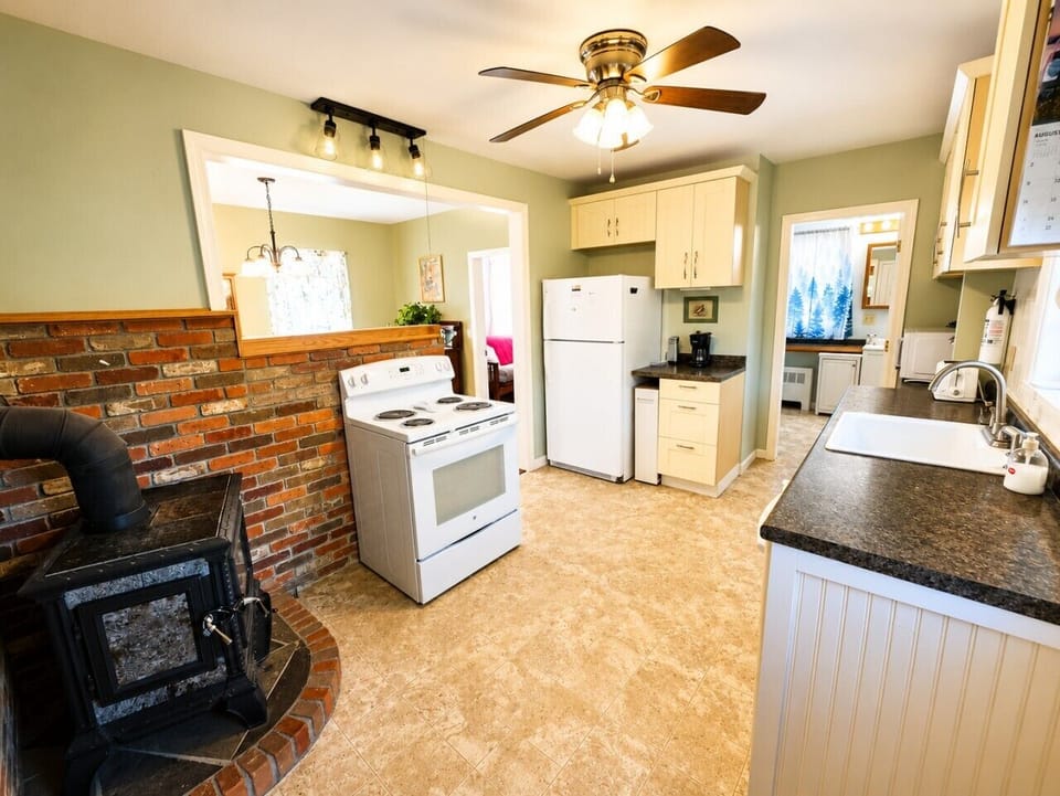 Bright, fully equipped kitchen with plenty of space for preparing meals during your stay.