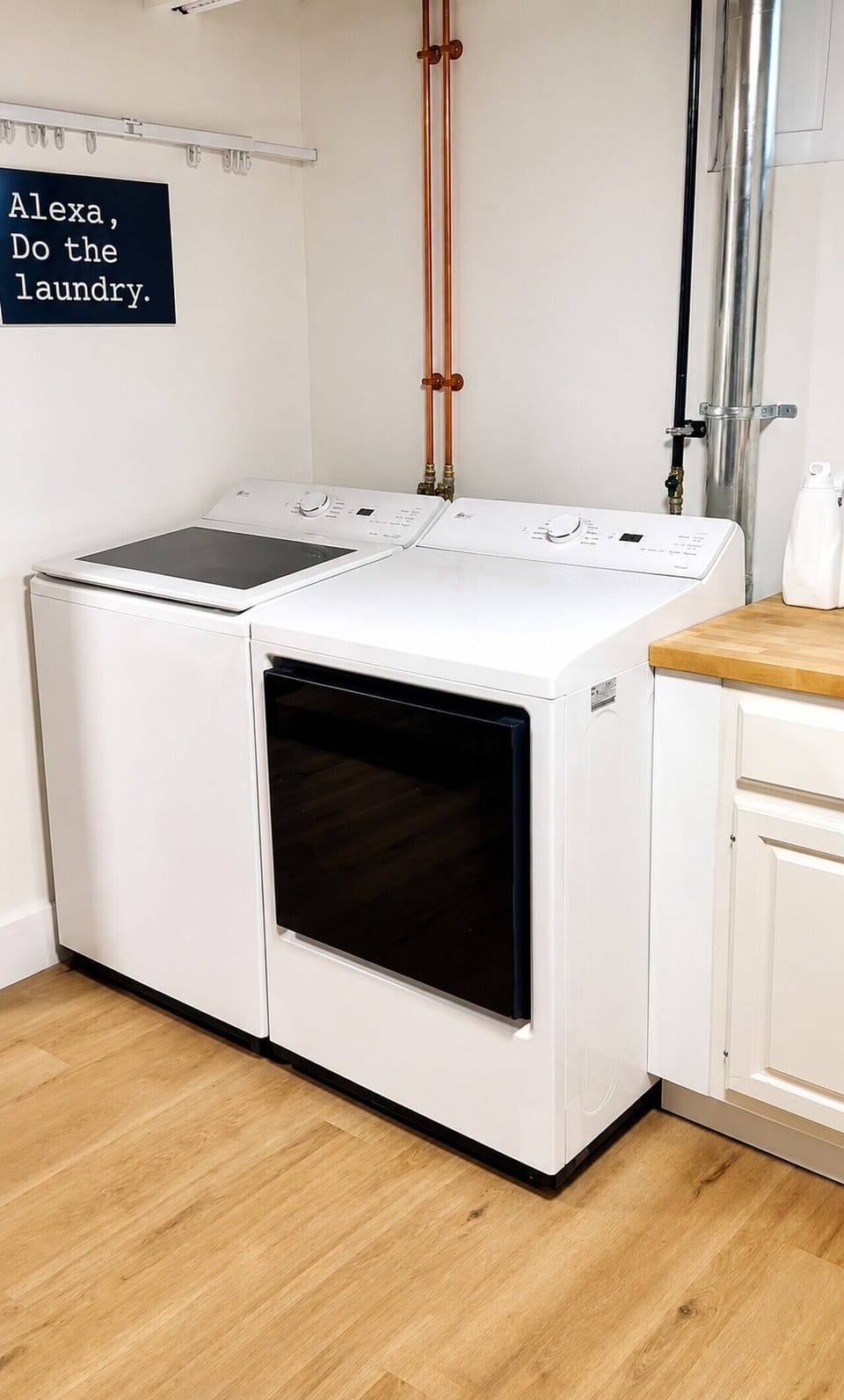Large capacity washer and dryer for your needs, with detergent, place to fold your clothes, iron if needed, or hang them to dry.