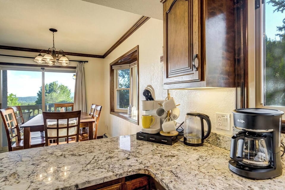 The fully-equipped kitchen features granite countertops, stainless steel appliances and ample space to prepare group meals.