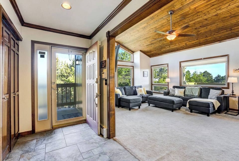 A tiled entry with a full coat closet, opening straight onto the living room

